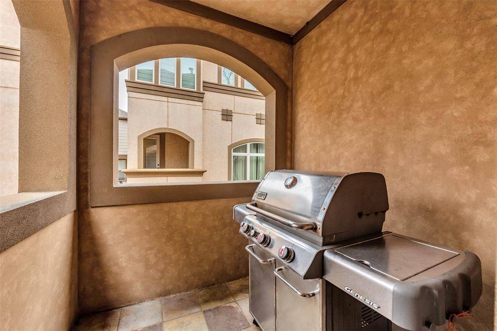 Right off the living room is the lovely balcony - the Weber grill is included in the sale.