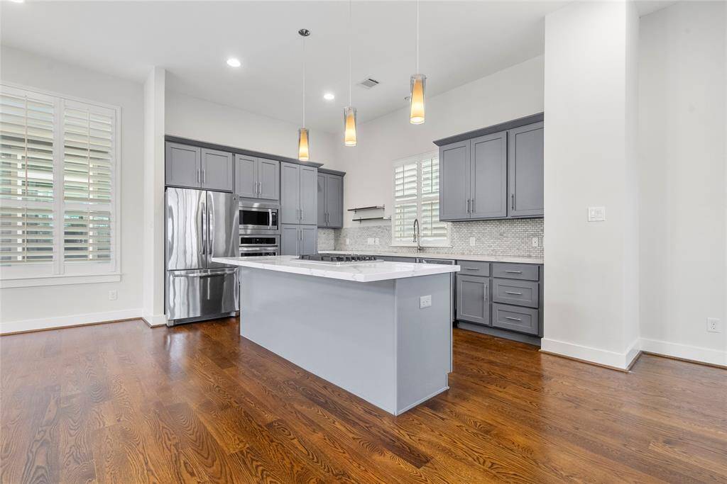 Stunning kitchen with functionality and style along with a large island and soft close drawers