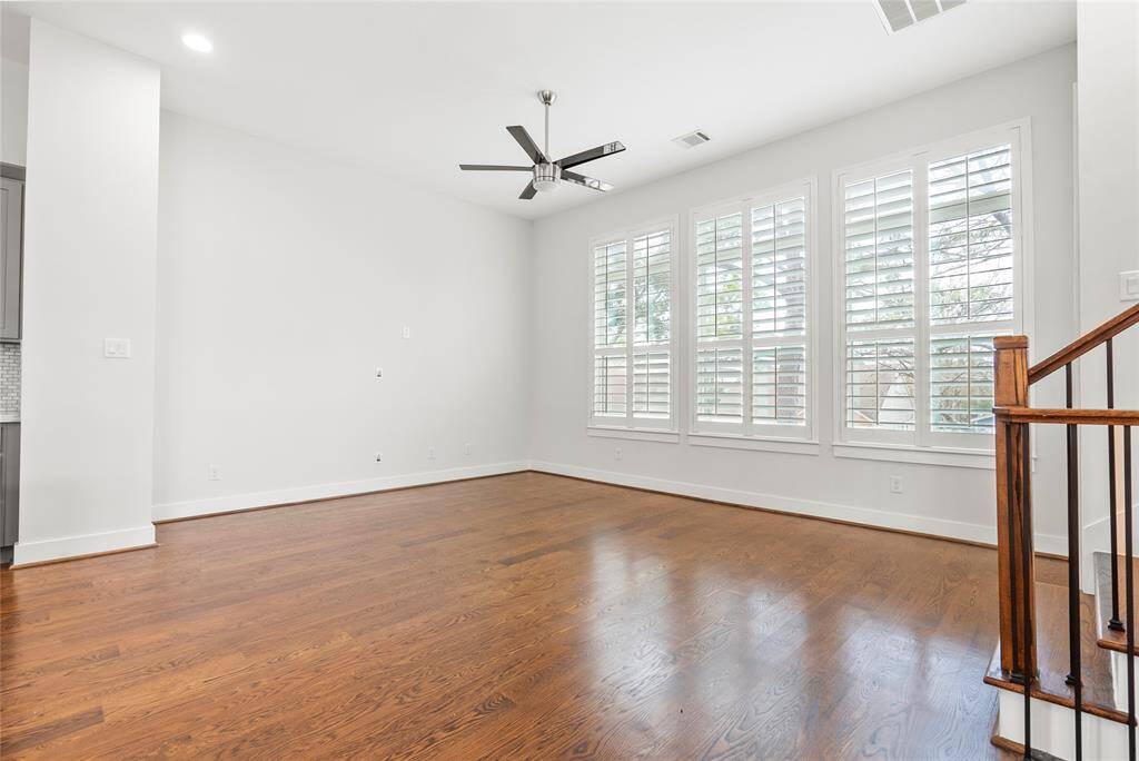 Spacious living room with high ceilings and an abundance of natural light