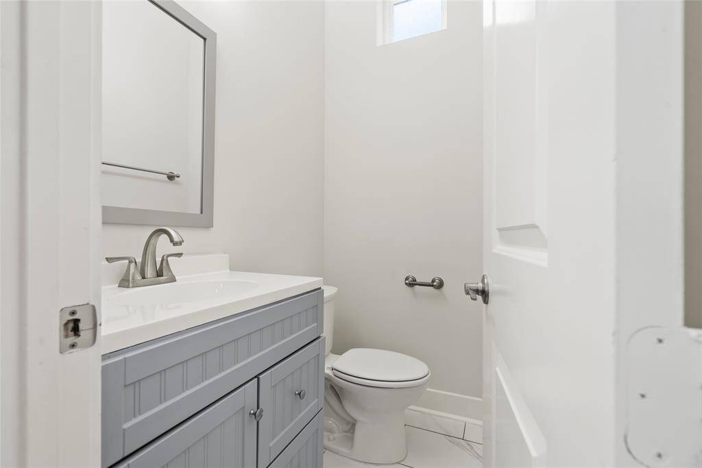 Half bath tucked away off of living room