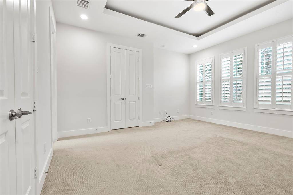 Beautiful Primary Suite with lots of natural light and tray ceilings.