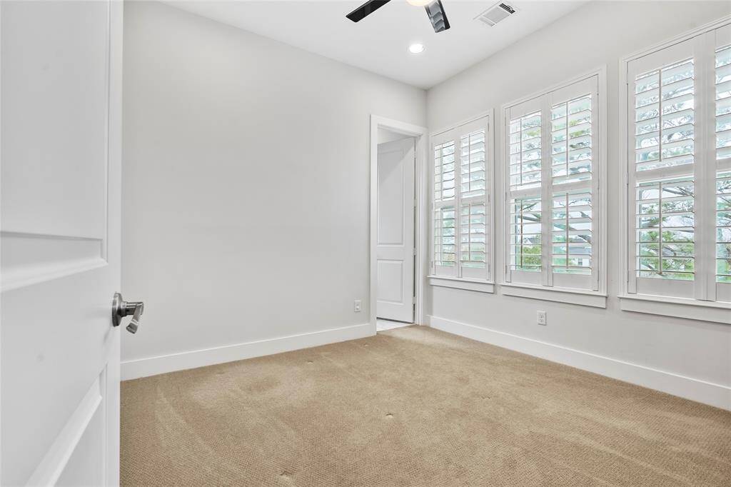This secondary bedroom is located on the 3rd floor down the hall from the primary suite. Ample space with lots of natural light and has an ensuite bath.