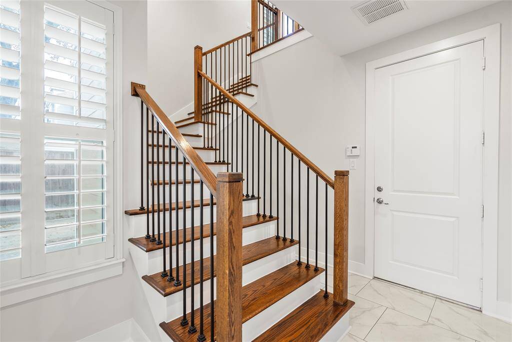 Upon entry, you are instantly greeted by a beautiful entry full of light with tiled floors, high ceilings and a gorgeous staircase leading to the main floor