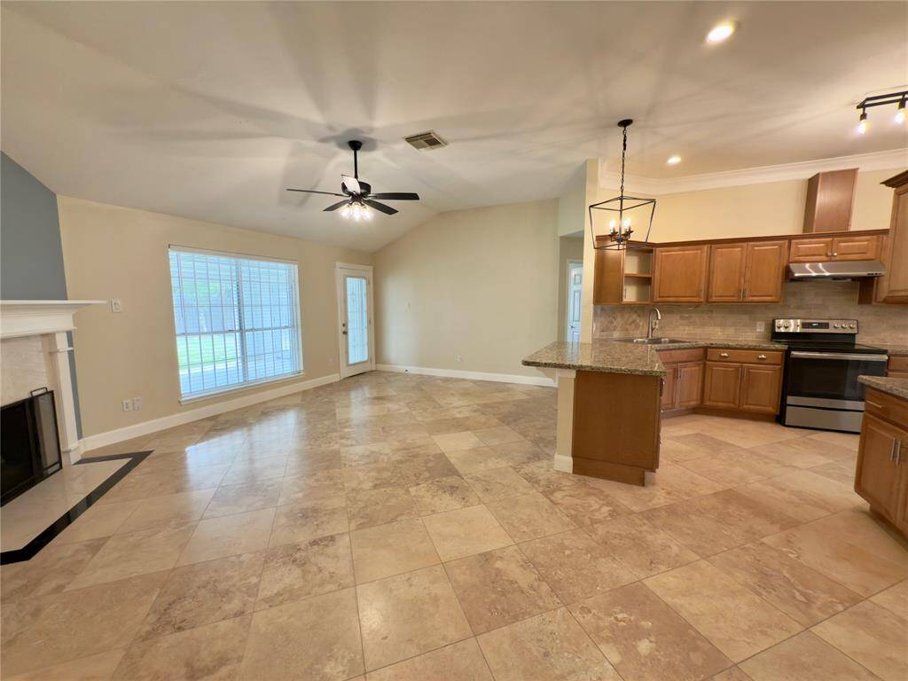 Kitchen opens up to living room