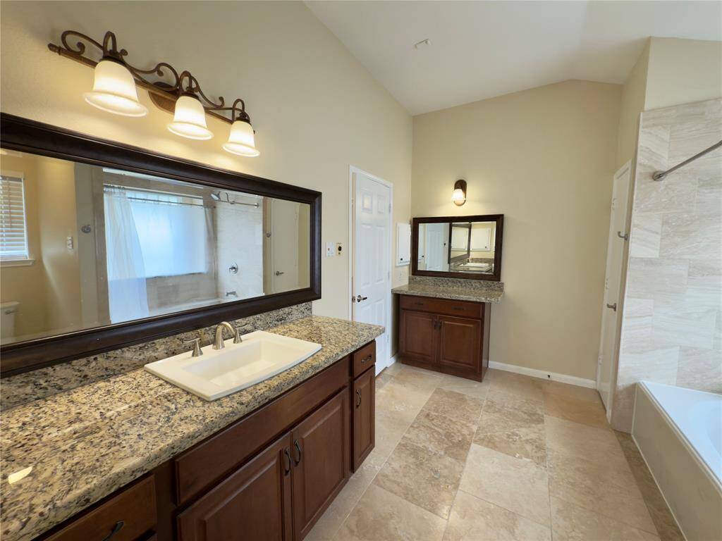 Primary bathroom with sink and vanity area