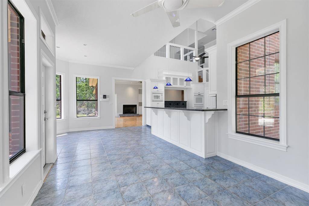 This area off the kitchen was used as a sunroom. Great flex space.