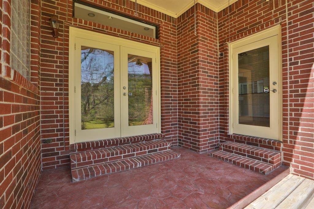 Step out of the primary bedroom onto this covered patio area.