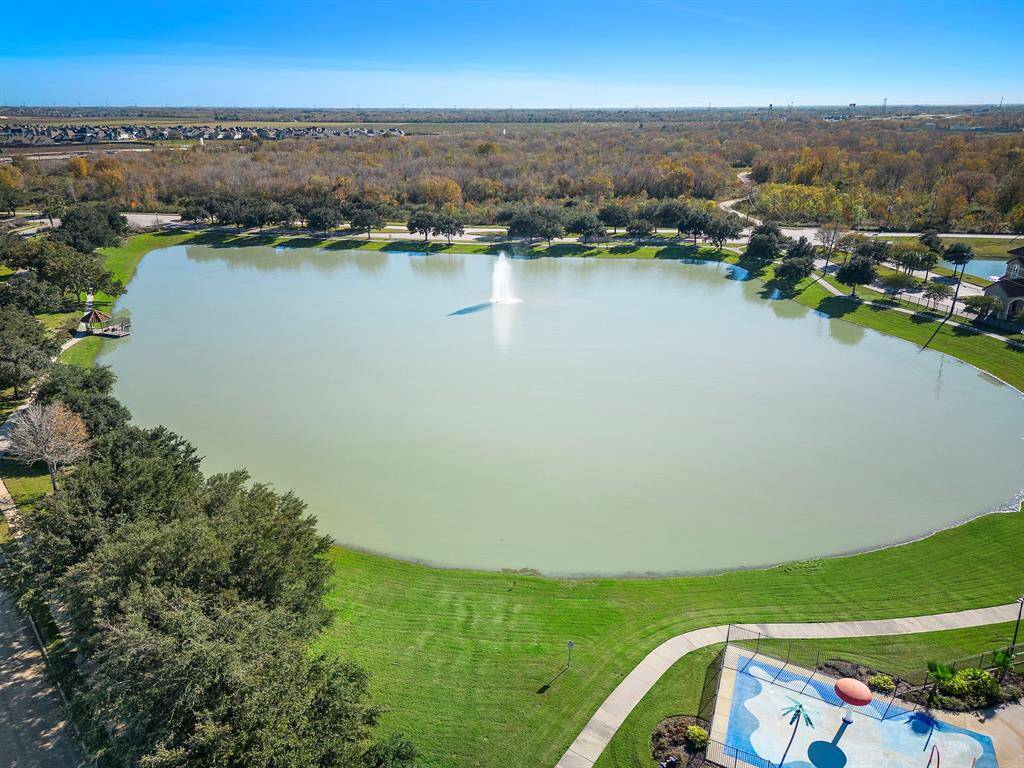 Enjoy serene waterfront living in Rodeo Palms, with expansive green spaces perfect for relaxation and leisure. The nearby community amenities include a lake, pool, clubhouse, and trails, offering a harmonious blend of nature and convenience.