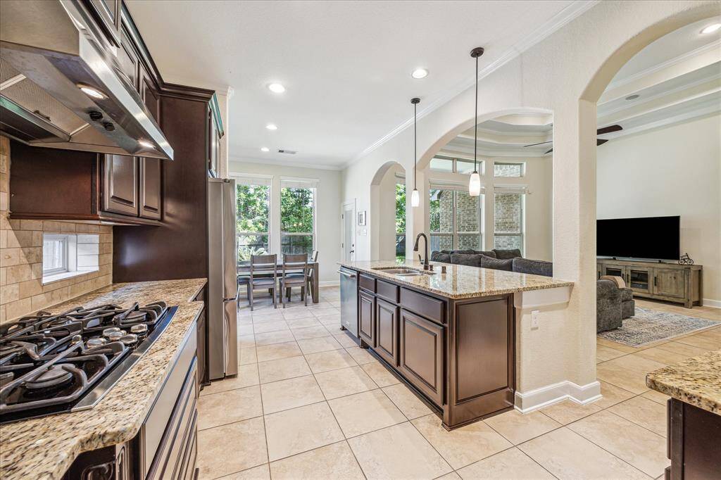 Different View of the Kitchen * Lots of Cabinets and Countertops * Recessed Lighting.