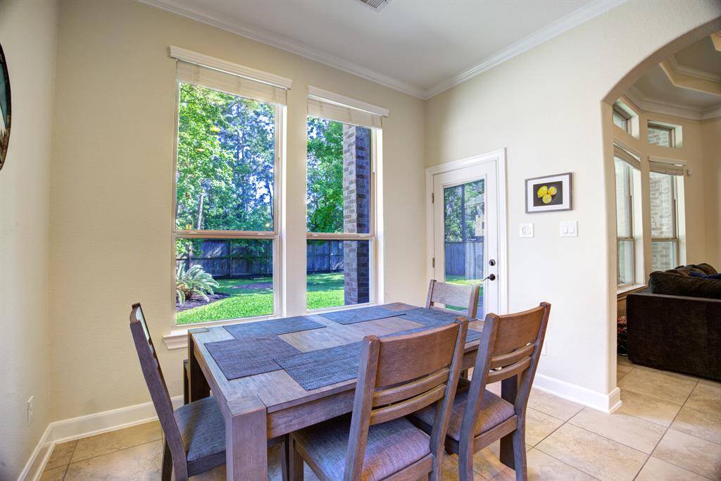 Breakfast Room * Overlooks the Backyard * Opens to the Kitchen and Family Room * Sunny and Bright.