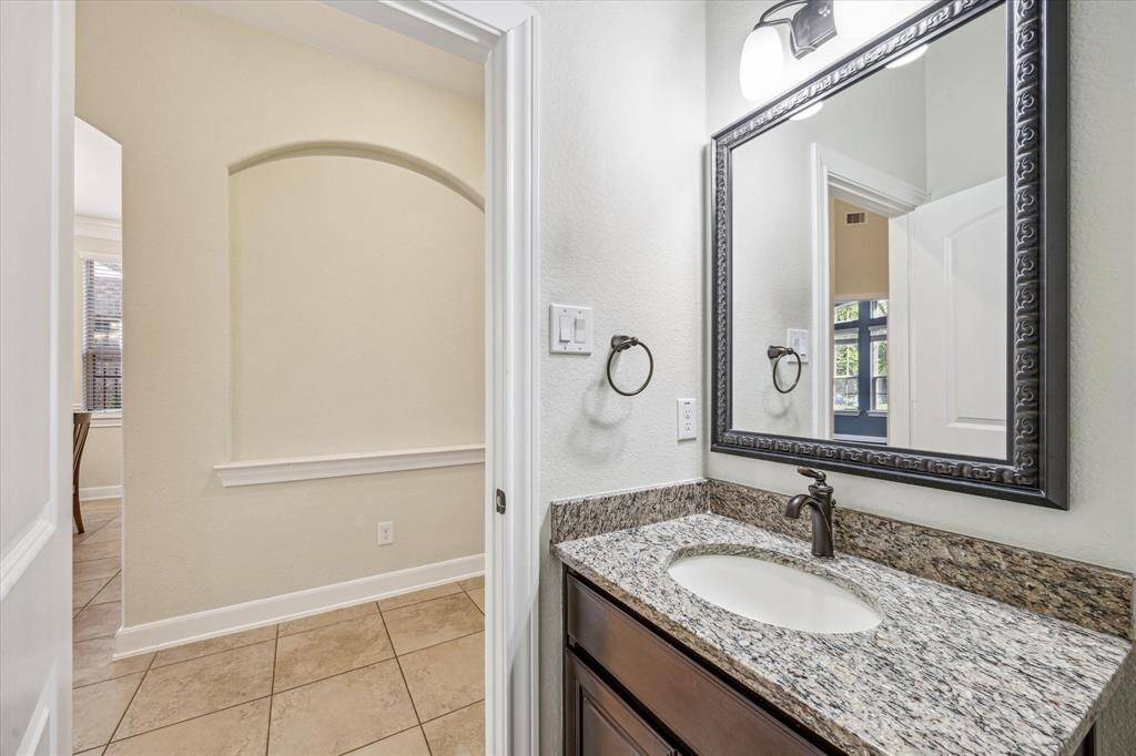 Powder Room on the First Floor * Art Niche Across the Hall * Granite Counter and Modern Finishes.