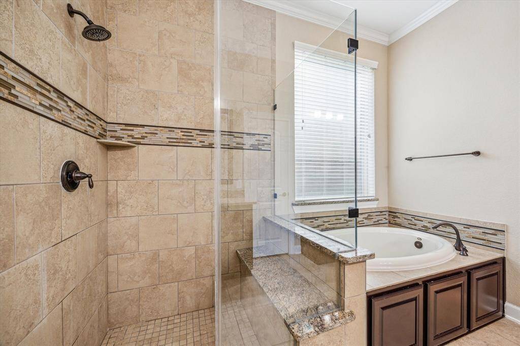 Spacious Frameless Shower with Bench Seating * Decorative Tile All the Way Up * Separate Tub * Private Water Closet (not pictured) to the Left of the Shower.