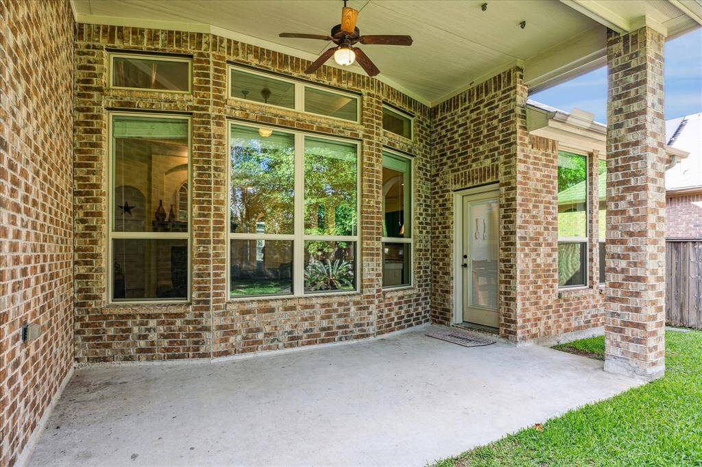 Large Covered Patio with Ceiling Fan * Approximately 17.2 X 8.10 * Great Space for Entertaining * Plenty of Room for Tables and Chairs.