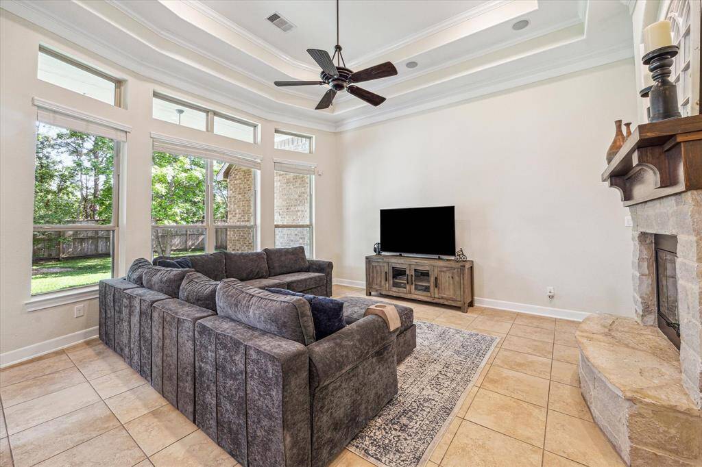 Family Room Faces the Backyard * Wall of Windows * Tray Ceiling for More Architectural Interest.
