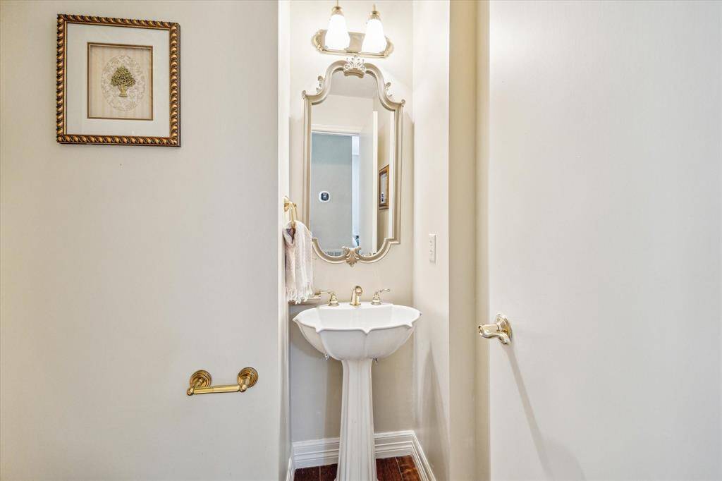 A conveniently located half bath is conveniently located between the entryway and the living room.