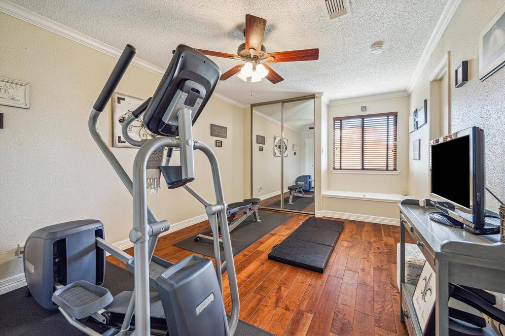 One of two secondary bedrooms currently being used as a gym.