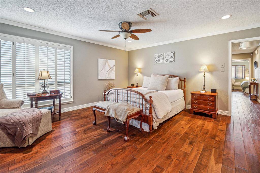 This light and airy primary features a walk-in closet and en-suite bathroom.