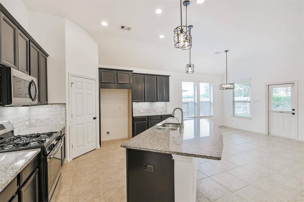 Awesome kitchen, open to the living room. Granite counters, staineless steel appliances. Great for entertaining.