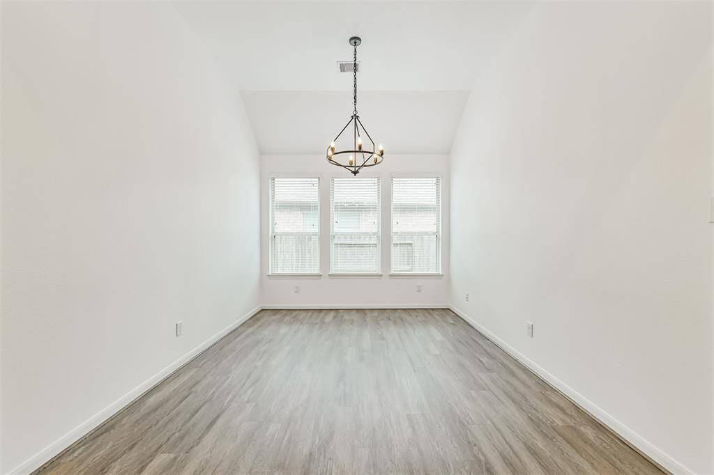 Light and bright dining room, with new flooring and fresh paint!