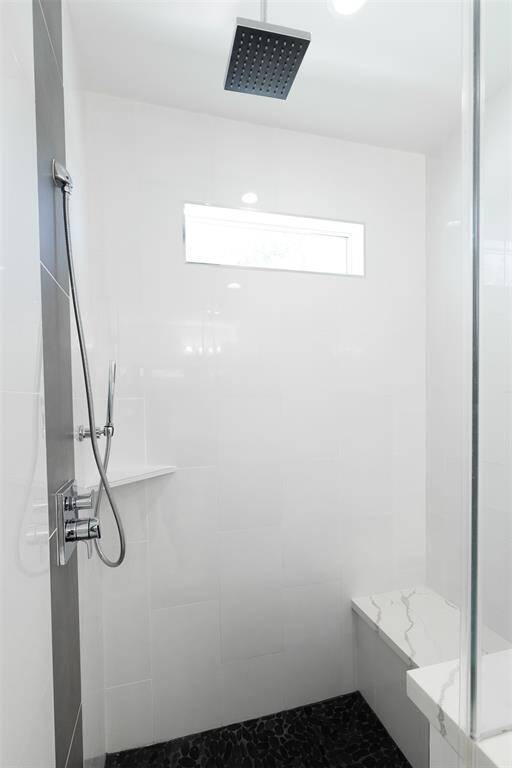 Large primary walk-in closet includes built-in shelving and drawers!