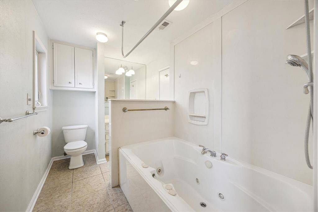 Primary bathroom features a jetted tub