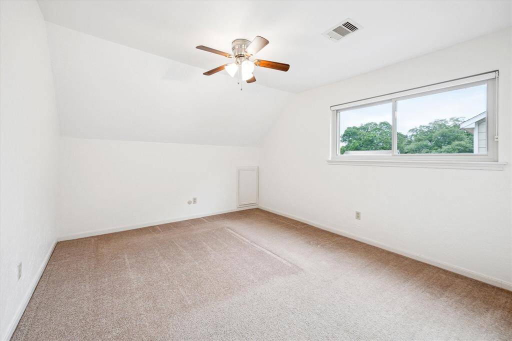 The second bedroom is off of the game room.