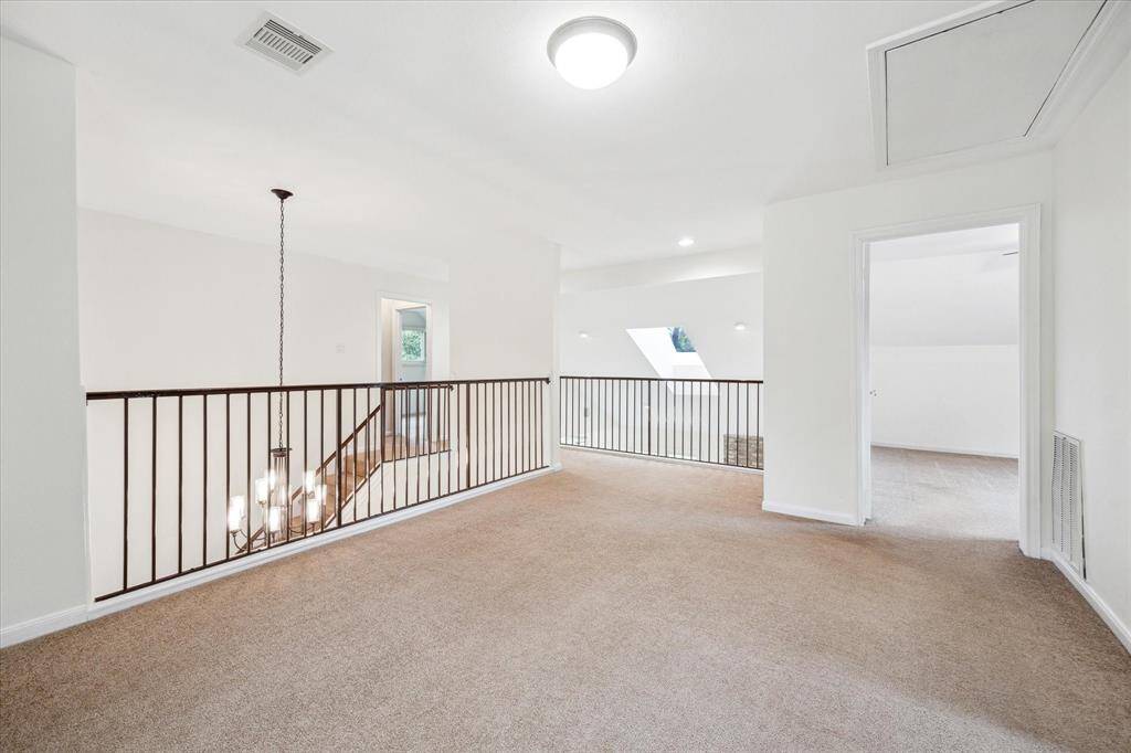 From the game room, access the second floor bathroom, as well as the three upstairs bedrooms.