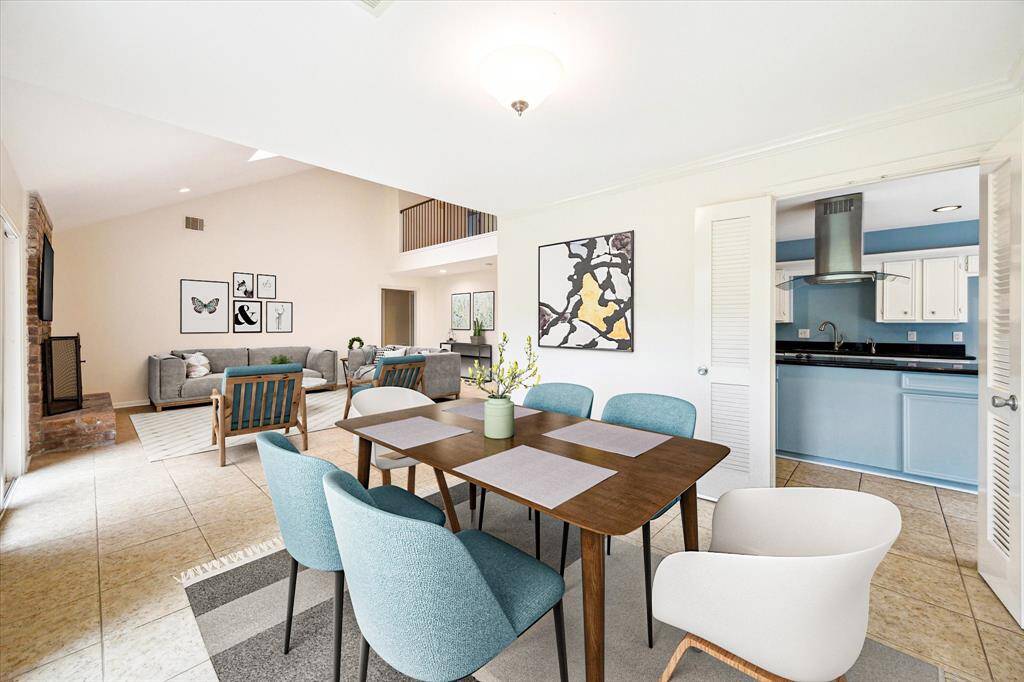 The dining room offers direct access to the kitchen, living room and backyard! Virtually staged.