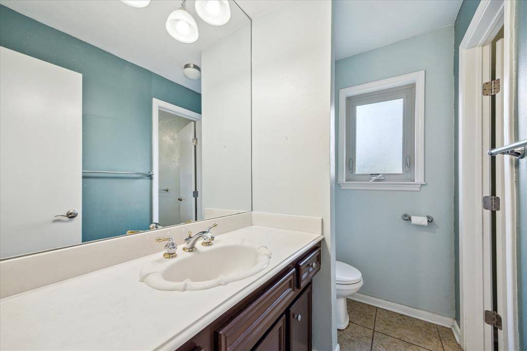 The half bath is located off of the living room.