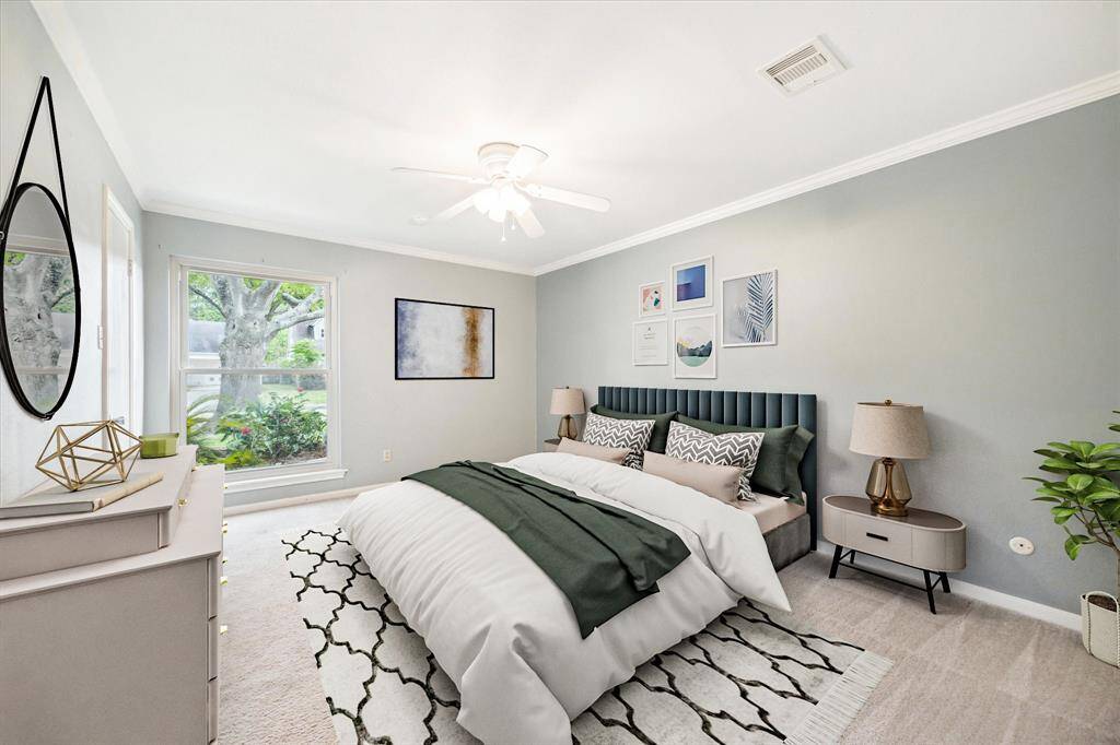 The primary bedroom is on the first floor. Virtually staged.