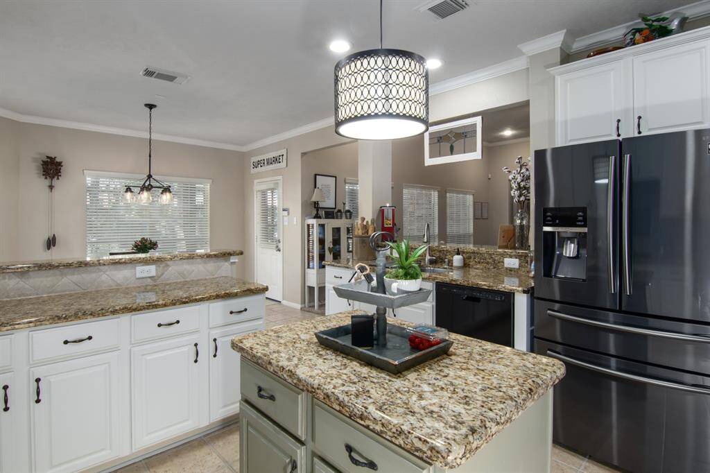 From this view you can see how open it is to the breakfast room and family room. The door leads you to the patio and backyard.