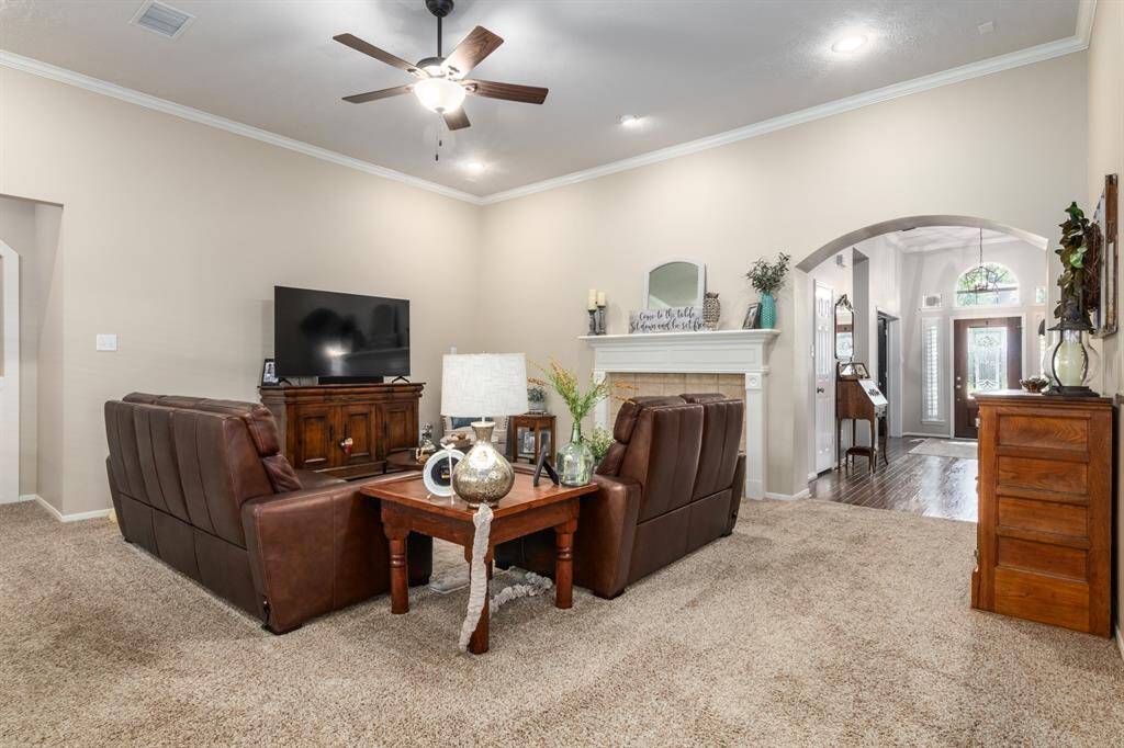 This view is from the breakfast/kitchen area. You can see the pretty arched area of the front entry. LOTS of high ceilings throughout the home.