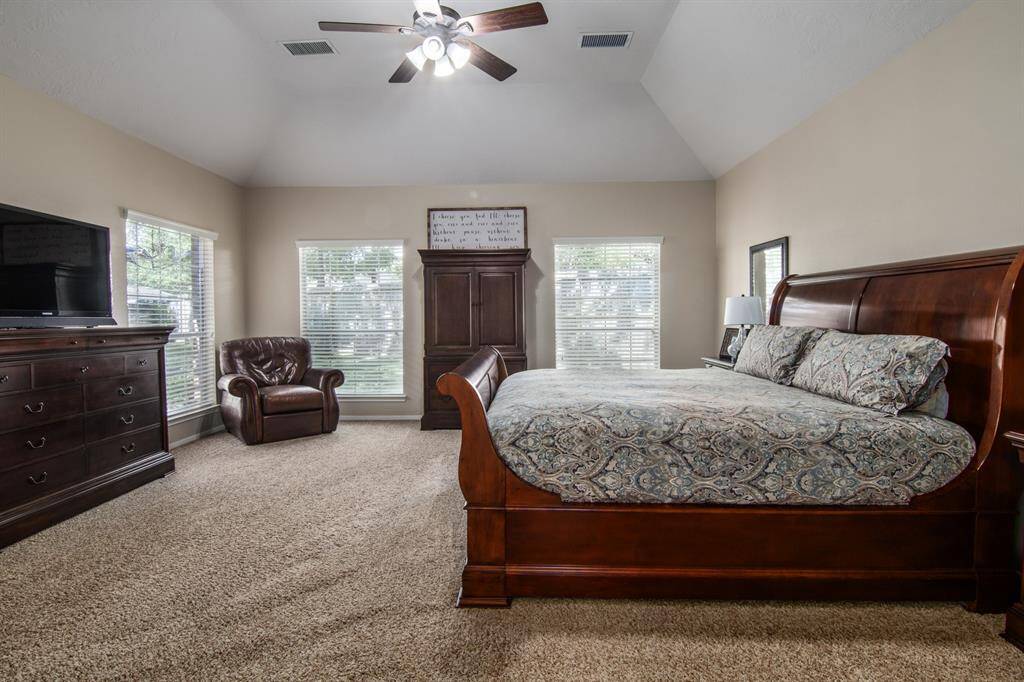 You can see just how large the primary bedroom really is! It has 3 large windows overlooking the backyard and patio space.