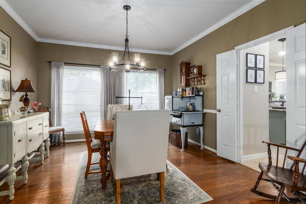 Next off the entry (and on the left) is a pretty dining room. The windows in this house are large and provide so much natural light. Hardwood floors in the entry, office, dining room and hallway leading to additional bedrooms. The door opening on the right takes you into the kitchen.
