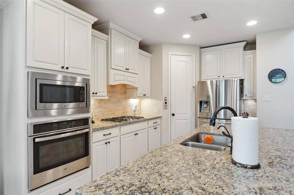 Convection oven and built-in microwave to save counter space! Corner walk in pantry is spacious and offers plenty of storage.