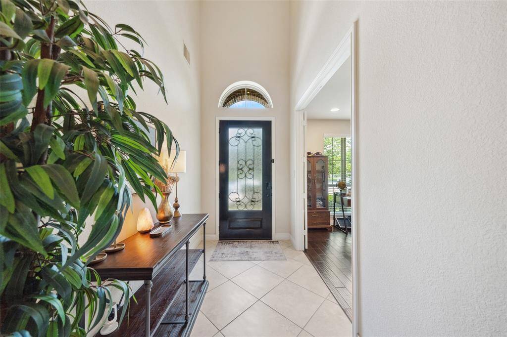 Front entry door with half moon transom light.