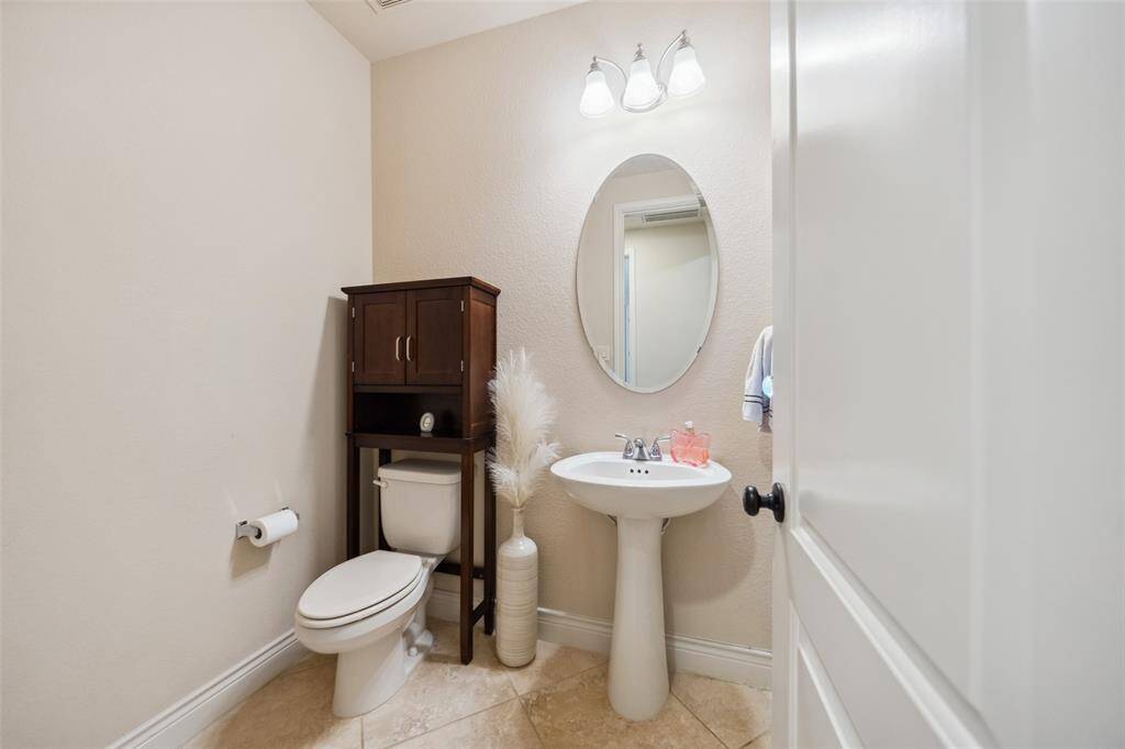 First floor powder room is convenient for guests.