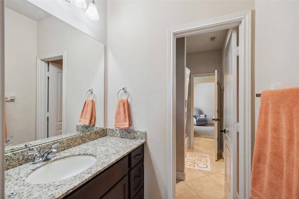 Sink area with large closet for guest bedroom #3 and connects to the shared tub/shower area.