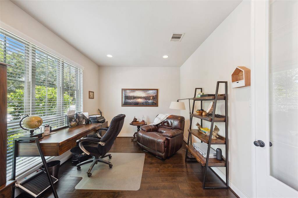 Home office with large window overlooking the front yard. This room could also be an exercise room, craft space or play room. It is a flexible space for any use!