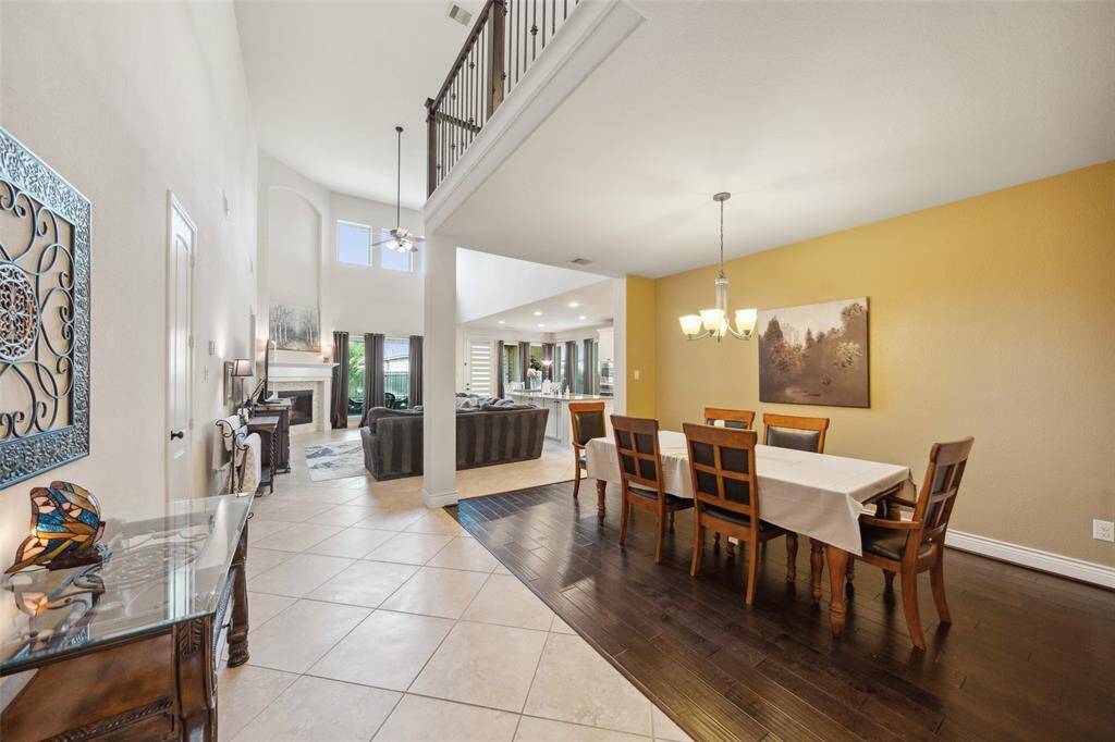 A look a the formal dining room with living room and kitchen beyond.