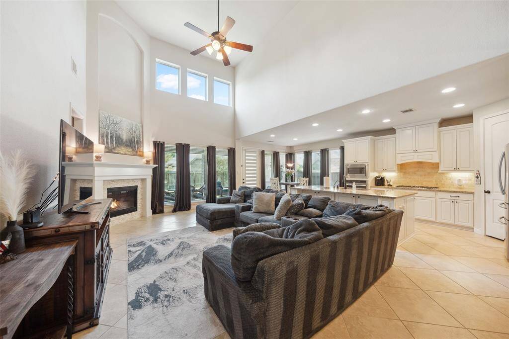 The open concept floor plan is great for entertaining or keeping up with family and high ceilings create an airy feel.