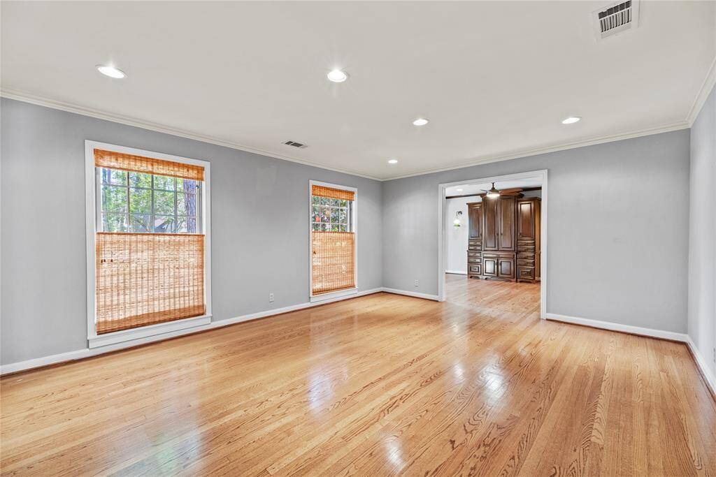 Bright and spacious dining room with framed view of gorgeous built-in custom cabinetry just inside the kitchen seating retreat.
