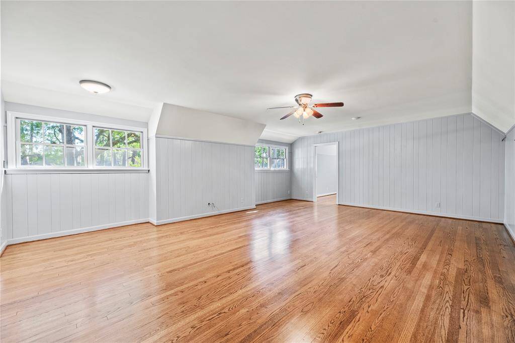 Large upstairs gameroom or flex space with multiple windows and endless possibilities for entertainment, media, or play.