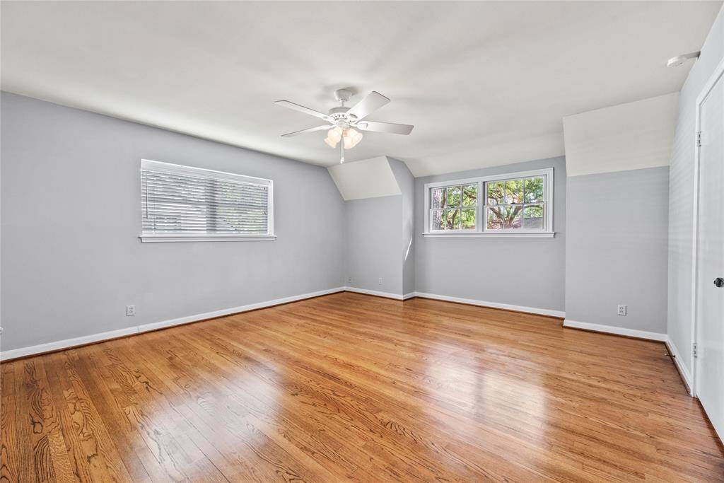 Secondary bedroom upstairs offers great natural light, neutral tones, and a generous layout—perfect for guests or family.