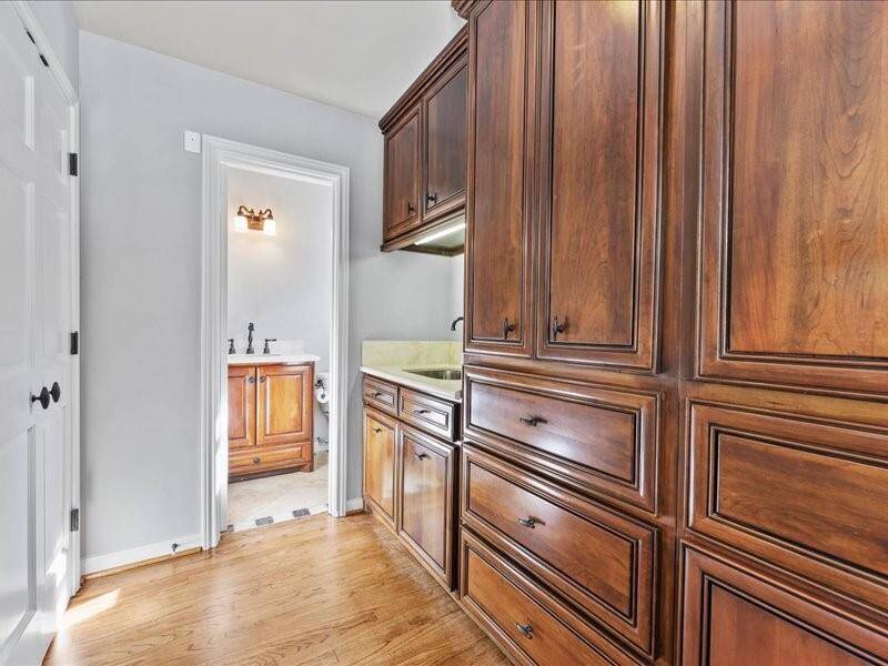 Convenient half bath located by the mudroom.