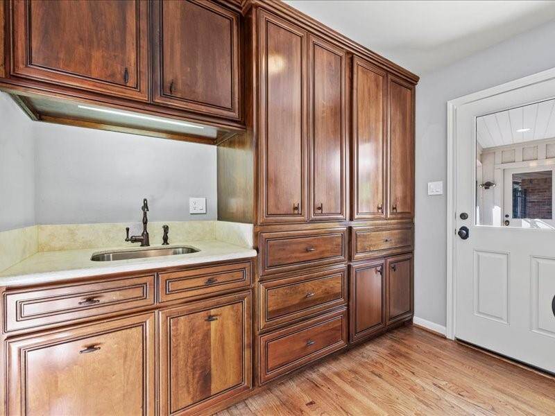 Beautiful wood cabinetry continues in the mudroom just as you enter from the back.