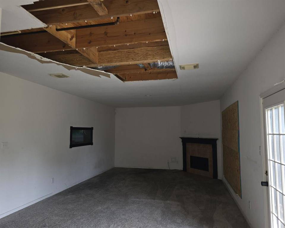 Wide view of sheetrock removed in the living area ceiling