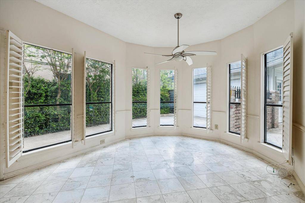 Breakfast room with plenty of natural light and wall to wall windows.