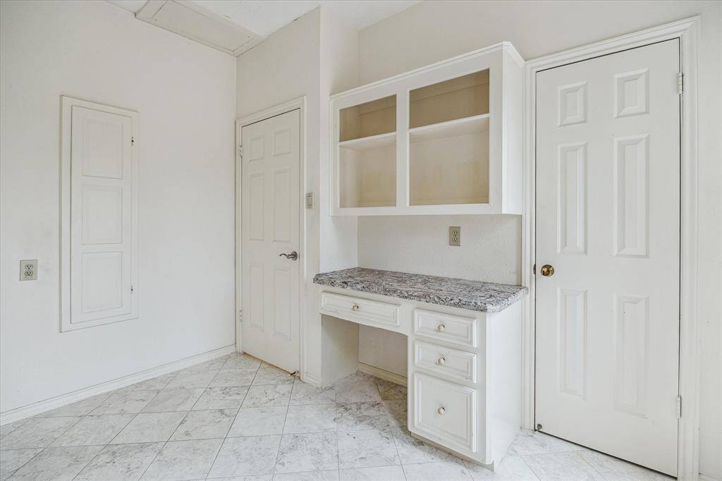 Home office or planning center located in the utility room area