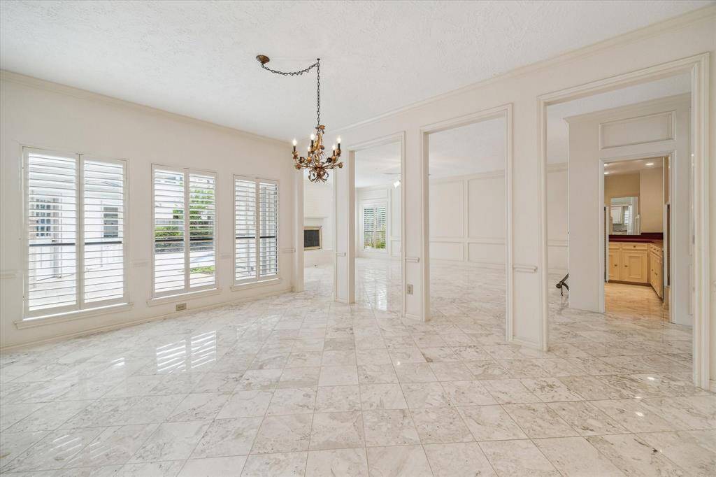 Formal dining room overlooking the backyard. Convenient access to the kitchen, family room and bar.